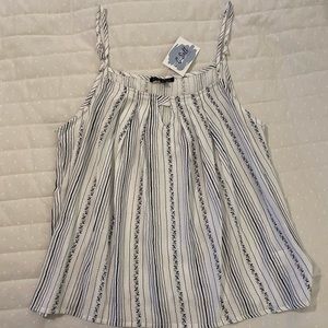 NWT cute flowy tank with keyhole detail neckline.